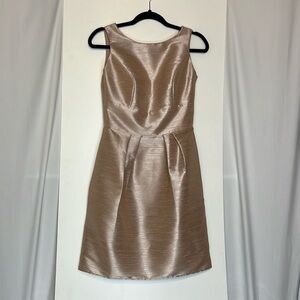 Alfred Sung Pearl Pink beautiful dress. Bow detail on the back. Small arms holes